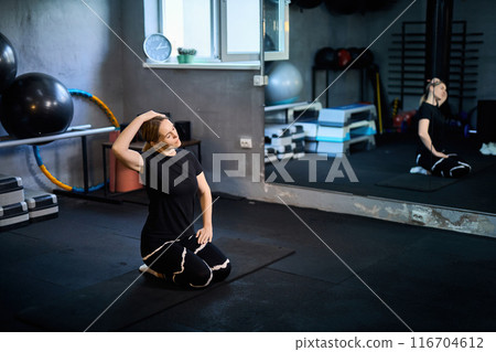 Young attractive sportive woman wearing activewear doing exercises at GYM, Young attractive sportive woman wearing activewear doing exercises at GYM, 116704612