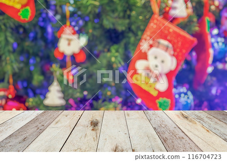 Empty wood table top with blur Christmas tree with bokeh light background 116704723