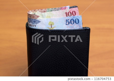 Saudi riyal in the black wallet 116704753