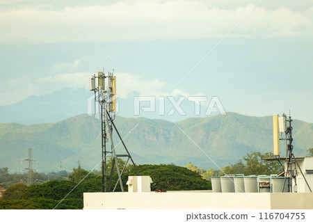 telecommunication tower mobile phone communication repeater antenna on the building telecommunication tower mobile phone communication repeater antenna on the building 116704755