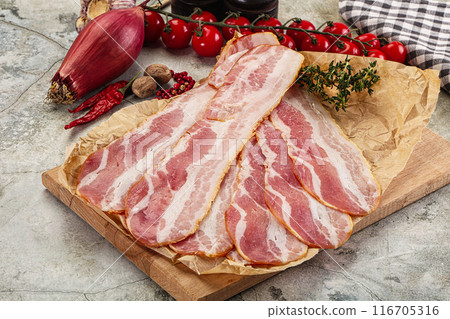 Sliced pork bacon over board Sliced pork bacon over board 116705316