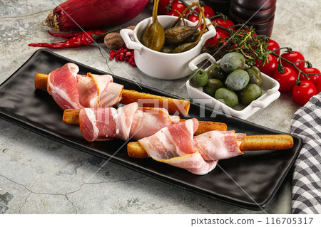 Antipasti - Grissini with pork bacon Antipasti - Grissini with pork bacon 116705317