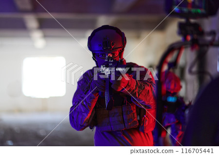 A professional cameraman captures the intense moments as a group of skilled soldiers embarks on a dangerous mission inside an abandoned building, their actions filled with suspense and bravery 116705441