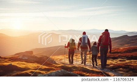 Parents and children pausing to enjoy a breathtaking sunset 116706324