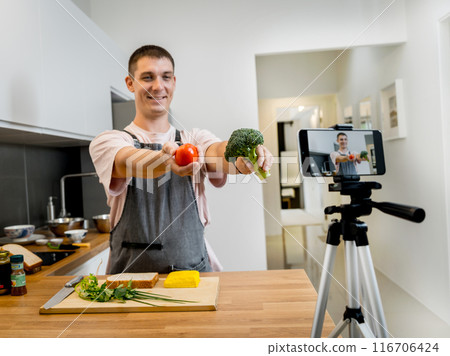 The chef is broadcasting live from workshop how to prepare a vegetarian food The chef is broadcasting live from workshop how to prepare a vegetarian food 116706424