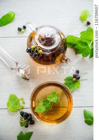 herbal tea from currant leaves and berries 116706607