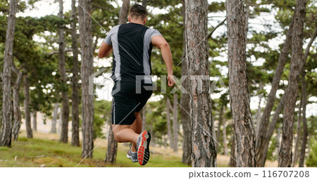 Determined Man Conquering Forest Obstacles with Grit and Speed Determined Man Conquering Forest Obstacles with Grit and Speed 116707208
