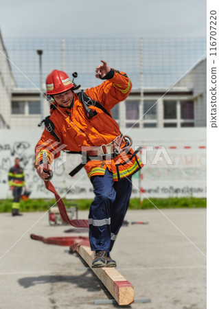 Firefighter Training and Preparing in Professional Gear for Job Hazards 116707220