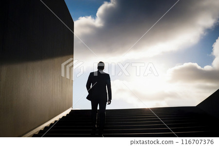man in a suit climbs the stairs to the sunlight, business motivation 116707376