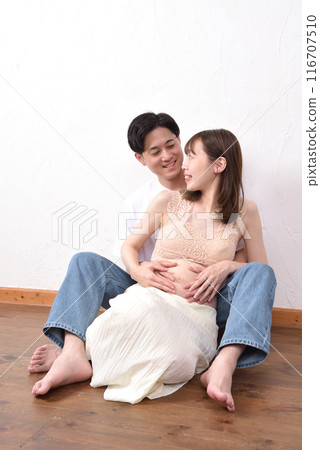 Young pregnant woman and her husband Young pregnant woman and her husband 116707510