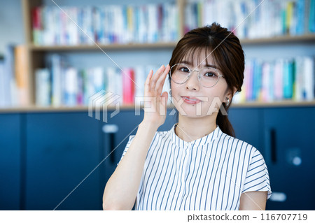Young female librarian Young female librarian 116707719