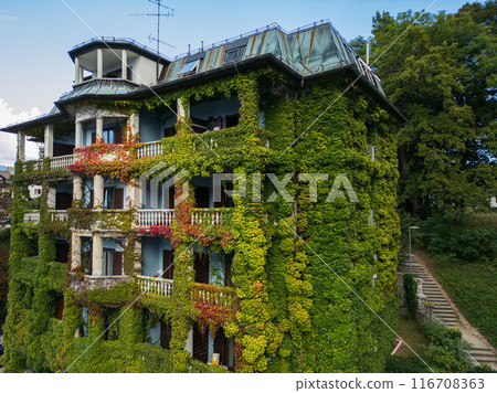 Drone shot flying. Slovenia. Green building. 116708363