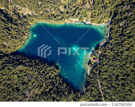 Drone shot flying. Lago Inferiore di Fusine Lake in Italy. Boat. 116708366