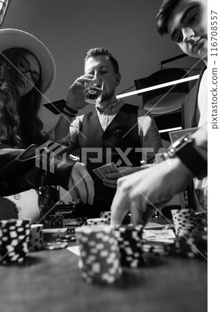 A team of young boys and girls play poker. First-person observation of card poker from various close-up angles. A team of young boys and girls play poker. First-person observation of card poker from various close-up angles. 116708557