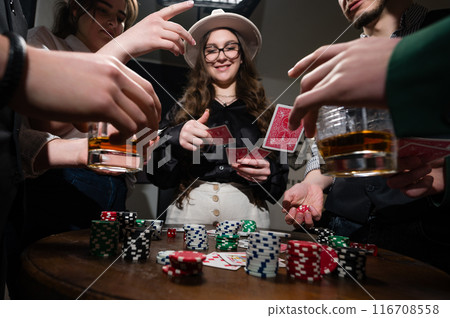 A team of young boys and girls play poker. First-person observation of card poker from various close-up angles. A team of young boys and girls play poker. First-person observation of card poker from various close-up angles. 116708558