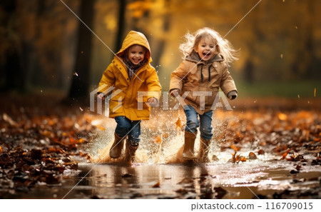 Against the backdrop of a rainy autumn day, two adorable little girls joyfully dash through puddles, their laughter echoing the pure delight of carefree childhood adventures.Generated image 116709015