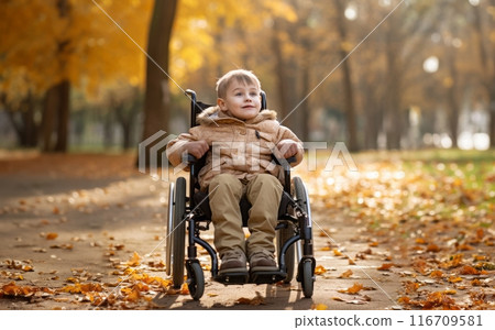 A beautiful young boy in a wheelchair enjoys a serene autumn day, surrounded by vibrant foliage in the park, embracing the wonders of nature with joy and curiosity.Generated image 116709581