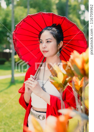 Northern Thai Chiangmai lanna people in traditional style clothes beautiful women old vintage dressing with paper umbrella at wat ton kwen. Northern Thai Chiangmai lanna people in traditional style clothes beautiful women old vintage dressing with paper umbrella at wat ton kwen. 116709962