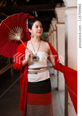 Northern Thai Chiangmai lanna people in traditional style clothes beautiful women old vintage dressing with paper umbrella at wat ton kwen. 116709968
