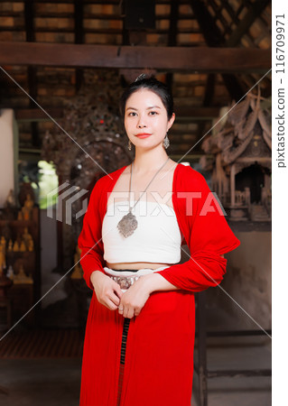 Northern Thai Chiangmai lanna people in traditional style clothes beautiful women old vintage dressing with paper umbrella at wat ton kwen. 116709971