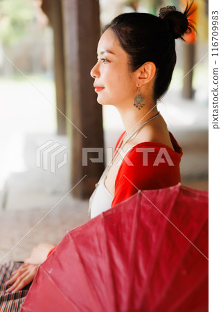 Northern Thai Chiangmai lanna people in traditional style clothes beautiful women old vintage dressing with paper umbrella at wat ton kwen. 116709983