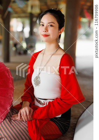 Northern Thai Chiangmai lanna people in traditional style clothes beautiful women old vintage dressing with paper umbrella at wat ton kwen. 116709986