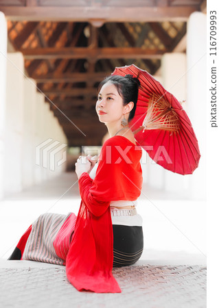 Northern Thai Chiangmai lanna people in traditional style clothes beautiful women old vintage dressing with paper umbrella at wat ton kwen. 116709993