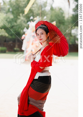Northern Thai Chiangmai lanna people in traditional style clothes beautiful women old vintage dressing with paper umbrella at wat ton kwen. 116710000