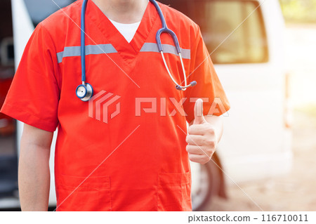 Paramedic doctor medical with stethoscope emergency team hand thumb up closeup Paramedic doctor medical with stethoscope emergency team hand thumb up closeup 116710011
