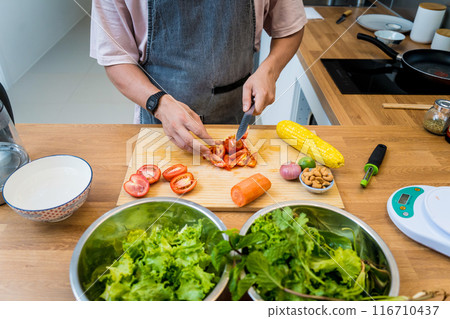 Chef at the kitchen preparing spicy glass noodle salad 116710437