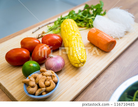Cutting board with ingredients for preparing spicy glass noodle salad 116710485