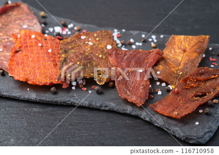 Mix of dried meat Jerky . From chicken , beef and pork. 116710958