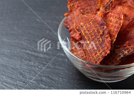 Mix of dried meat Jerky . From chicken , beef and pork. 116710964