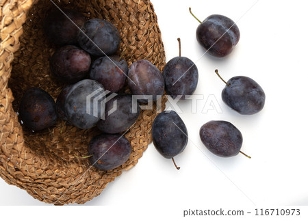 ripe plums isolated on white background 116710973