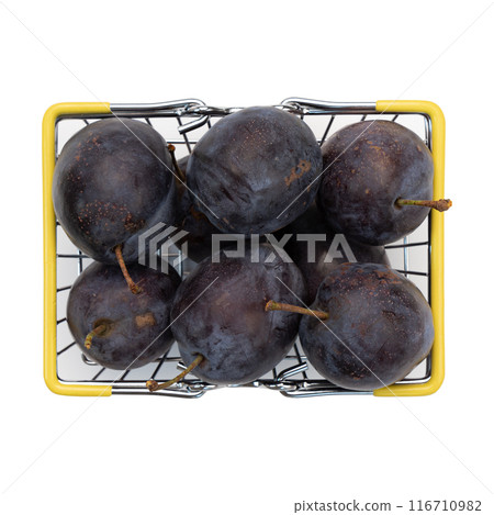 ripe plums in basket isolated on white background 116710982