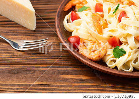 Italian pasta with shrimps , parmesan and tomatoes Italian pasta with shrimps , parmesan and tomatoes 116710983