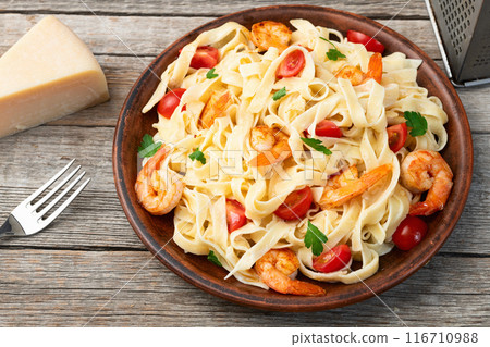 Italian pasta with shrimps , parmesan and tomatoes Italian pasta with shrimps , parmesan and tomatoes 116710988