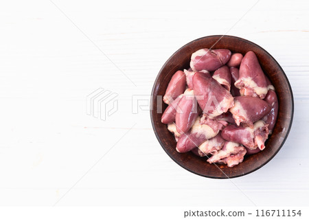 Raw chicken giblets hearts , meat background Raw chicken giblets hearts , meat background 116711154