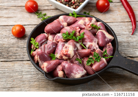 Raw chicken giblets hearts , meat background Raw chicken giblets hearts , meat background 116711158