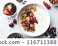 Baked granola with yogurt and fresh berries 116711388