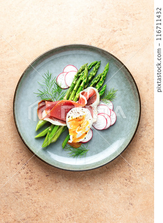 Asparagus and poached eggs with jamon and fresh dill Asparagus and poached eggs with jamon and fresh dill 116711432