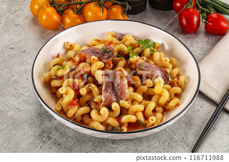 Italian pasta cellentani with anchovy 116711988