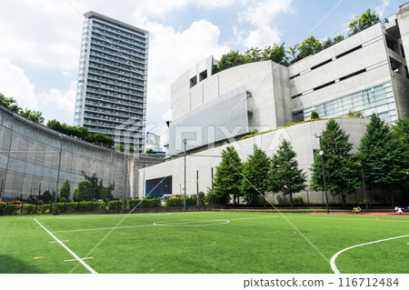 View of the Prism Tower from Opus Yumehiroba, in front of Ikejiri-Ohashi Station, clear summer sky, Meguro-ku, Tokyo 116712484