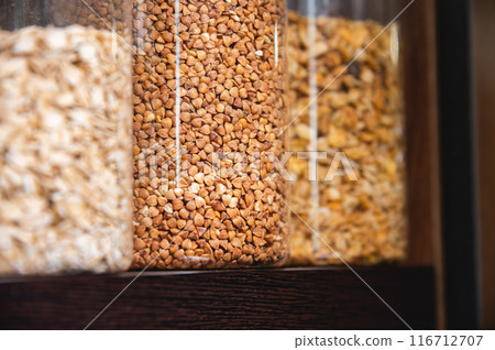 Kitchen pantry, jars and containers with food, food storage. Jars of cereals, kitchen utensils 116712707