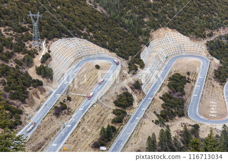 Closeup on China G318 national highway 18 bends. It is one of the popular tourist attraction where the road winds uphill 26km from the county seat of Yajiang to Jianziwan Mountain Pass. Closeup on China G318 national highway 18 bends. It is one of the popular tourist attraction where the road winds uphill 26km from the county seat of Yajiang to Jianziwan Mountain Pass. 116713034