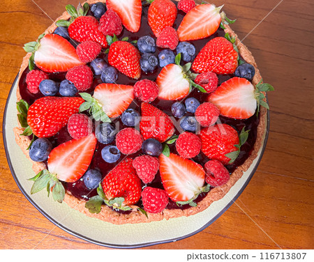 Freshly baked baskets with curd cream and strawberries Freshly baked baskets with curd cream and strawberries 116713807