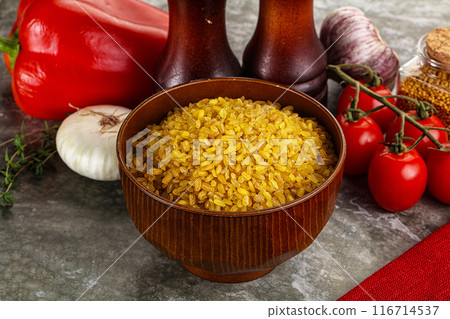 Dry wheat bulgur cereal heap 116714537