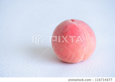 1 peach on a simple white background 1 peach on a simple white background 116714877