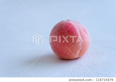 1 peach on a simple white background 116714879