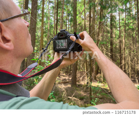 "Nature photography and travel scenes featuring photographers at work in green forests and "Nature photography and travel scenes featuring photographers at work in green forests and 116715178